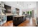 Kitchen features island with seating, stainless steel appliances, and hardwood floors at 5241 Marston Rd, Atlanta, GA 30360