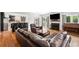 Open living area showcasing hardwood floors, stone fireplace, and view to the kitchen at 5241 Marston Rd, Atlanta, GA 30360