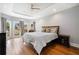 Spacious main bedroom with trey ceiling, hardwood floors, and backyard views at 5241 Marston Rd, Atlanta, GA 30360