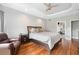 Cozy main bedroom with hardwood floors and a doorway leading to the bathroom at 5241 Marston Rd, Atlanta, GA 30360