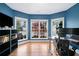 Bright office space with hardwood floors, multiple windows, and modern furnishings at 5241 Marston Rd, Atlanta, GA 30360