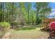 Expansive backyard featuring trees, a deck, and a patio area at 5286 Westhill Dr, Norcross, GA 30071