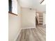A partially finished basement with modern flooring and ample natural light at 5286 Westhill Dr, Norcross, GA 30071