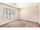 Cozy bedroom featuring natural light and carpet flooring at 5286 Westhill Dr, Norcross, GA 30071