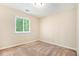 Bedroom featuring neutral walls, carpet, and window with view of trees at 5286 Westhill Dr, Norcross, GA 30071