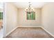 Dining room showcasing a chandelier and decorative window with light-colored walls at 5286 Westhill Dr, Norcross, GA 30071