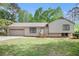 Charming single-Gathering home with a two-car garage and a well-manicured lawn at 5286 Westhill Dr, Norcross, GA 30071