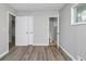 A bedroom featuring access to the bathroom with modern gray walls at 3711 Daisy Dr, Decatur, GA 30032