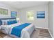 Bedroom featuring updated bed, natural light, wood floors, and art at 3711 Daisy Dr, Decatur, GA 30032