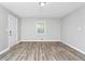 Clean and bright bedroom featuring new flooring and fresh paint, creating a welcoming and serene atmosphere at 3711 Daisy Dr, Decatur, GA 30032