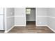 Open-concept living room featuring wood-look flooring and neutral paint, creating a bright and inviting space at 3711 Daisy Dr, Decatur, GA 30032