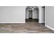 Spacious living room with updated wood floors and gray walls, perfect for entertaining at 3711 Daisy Dr, Decatur, GA 30032