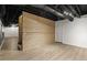 View of a finished basement with exposed duct work and a decorative wood slat wall at 3765 Michaels Way, Cumming, GA 30040