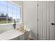 Spa-like bathroom featuring a soaking tub, large window, and elegant fixtures at 3765 Michaels Way, Cumming, GA 30040