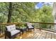 Inviting outdoor deck with comfortable seating, perfect for relaxing amidst lush greenery at 3765 Michaels Way, Cumming, GA 30040