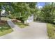 House with long driveway leading to a two car garage next to the home at 3765 Michaels Way, Cumming, GA 30040
