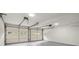 Spacious two-car garage featuring automatic doors and ample room for storage at 3765 Michaels Way, Cumming, GA 30040