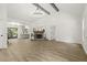 Spacious living area showcasing a stone fireplace, vaulted ceilings with wood beams, and hardwood flooring at 3765 Michaels Way, Cumming, GA 30040