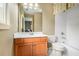Bathroom featuring a single vanity, toilet and tub with shower combo at 3907 Fellowship Dr, Buford, GA 30519
