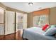 This bedroom features laminate floors, two doors, and one window at 3907 Fellowship Dr, Buford, GA 30519