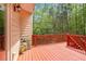 Inviting deck area surrounded by lush greenery, ideal for relaxation and outdoor enjoyment at 3907 Fellowship Dr, Buford, GA 30519