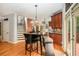 Dining area featuring wood floors, a table with seating, and doors leading to an outdoor deck at 3907 Fellowship Dr, Buford, GA 30519