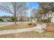 Community green space with sidewalks, trees, and benches, creating a serene environment at 3907 Fellowship Dr, Buford, GA 30519