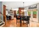 Modern kitchen with dark wood cabinetry, stainless steel appliances, and an eat-in area leading to the deck at 3907 Fellowship Dr, Buford, GA 30519