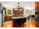 Spacious kitchen featuring stainless steel appliances, granite countertops, and a center island with seating at 3907 Fellowship Dr, Buford, GA 30519
