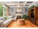 Elegant living room featuring a fireplace, a large window, and comfortable seating, perfect for relaxation at 3907 Fellowship Dr, Buford, GA 30519