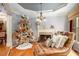Cozy living room with hardwood floors, fireplace, and bright natural light from large picture window at 3907 Fellowship Dr, Buford, GA 30519