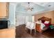 Main bedroom featuring a decorative tray ceiling, a seating area, and a large bed with elegant decor at 3907 Fellowship Dr, Buford, GA 30519