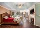 Spacious main bedroom featuring a fireplace, a seating area, and elegant decor, creating a relaxing retreat at 3907 Fellowship Dr, Buford, GA 30519