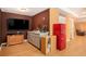 Recreation room with a vintage-style red refrigerator, a small wash room, and entertainment center at 3907 Fellowship Dr, Buford, GA 30519