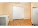Spacious room with wood flooring and double doors with storage space, perfect for a multi-purpose area at 3907 Fellowship Dr, Buford, GA 30519