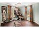 Light-filled walk-in closet with hardwood floors and shelves for shoes at 3907 Fellowship Dr, Buford, GA 30519