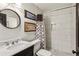 Updated bathroom with marble vanity, a tiled shower, and modern fixtures at 1899 Cooper Landing Se Dr, Smyrna, GA 30080