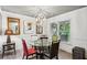 Dining room features stylish chandelier, table, and natural light at 1899 Cooper Landing Se Dr, Smyrna, GA 30080