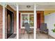 Cozy front porch with brick accents and two chairs perfect for relaxing outdoors at 1899 Cooper Landing Se Dr, Smyrna, GA 30080