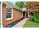 Charming brick home with a well-manicured lawn and lush landscaping at 1899 Cooper Landing Se Dr, Smyrna, GA 30080