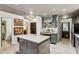 Open kitchen featuring a gray island, stainless steel appliances, and view of the breakfast area at 1899 Cooper Landing Se Dr, Smyrna, GA 30080