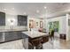 Updated kitchen with island, gray cabinets and views to the dining area at 1899 Cooper Landing Se Dr, Smyrna, GA 30080
