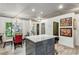 Bright kitchen with granite island, modern light fixture, breakfast table, and stylish decor at 1899 Cooper Landing Se Dr, Smyrna, GA 30080