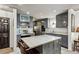 Updated kitchen features a center island, stainless steel appliances and modern gray cabinetry at 1899 Cooper Landing Se Dr, Smyrna, GA 30080