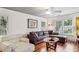 Bright and airy living room with hardwood floors, comfortable sofas, and natural light at 1899 Cooper Landing Se Dr, Smyrna, GA 30080
