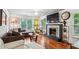 The living room features a fireplace, hardwood floors, and natural light at 1899 Cooper Landing Se Dr, Smyrna, GA 30080