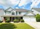 Charming two-story home with manicured lawn and attached two car garage at 2896 Spence Ct, Dacula, GA 30019