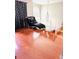 Bright room showcasing hardwood floors, natural light, and modern black chair at 2896 Spence Ct, Dacula, GA 30019