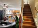 Open concept living room and kitchen with hardwood floors and staircase to the second floor at 2896 Spence Ct, Dacula, GA 30019