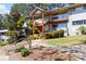 Brick apartment building with a covered entrance, multiple levels, and well-maintained landscaping at 3046 Briarcliff Ne Rd # 7, Atlanta, GA 30329